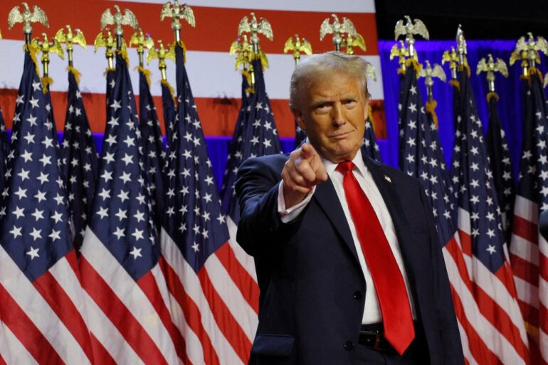 Republican presidential nominee and former U.S. President Donald Trump takes the stage to address supporters at his rally, at the Palm Beach County Convention Center in West Palm Beach, Florida, U.S., November 6, 2024.