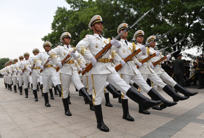 TOPSHOT - Members of a Chinese military honour guard rehearse for a welcome ceremony for Uzbekistan President Shavkat Mirziyoyev outside the Great Hall of the People in Beijing on May 12, 2017. Mirziyoyev is on a state visit to China to attend the Belt and Road Forum for International Cooperation. (Photo by GREG BAKER / AFP) (Photo by GREG BAKER/AFP via Getty Images)