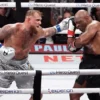 Mike Tyson (black gloves) fights Jake Paul (silver gloves) at AT&T Stadium. Kevin Jairaj-Imagn Images/File Photo