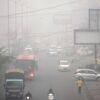 Commuters drive through a thick layer of smog as air pollution shoots up in New Delhi, India, on Nov. 18, 2024.