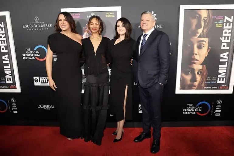 Cast members Karla Sofia Gascon, Zoe Saldana and Selena Gomez pose with CEO of Netflix Ted Sarandos at a screening of the film Emilia Perez on the opening night of the 28th Annual American French Film Festival in Los Angeles, California, U.S., October 29, 2024. REUTERS/Mario Anzuoni/ File Photo