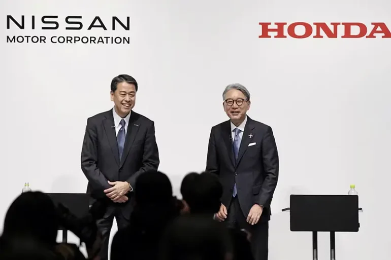 Makoto Uchida, president and CEO of Nissan Motor, and Toshihiro Mibe, Honda Motor president and CEO, attend their joint press conference in Tokyo, Japan March 15, 2024. Mandatory credit Kyodo/via REUTERS/File Photo