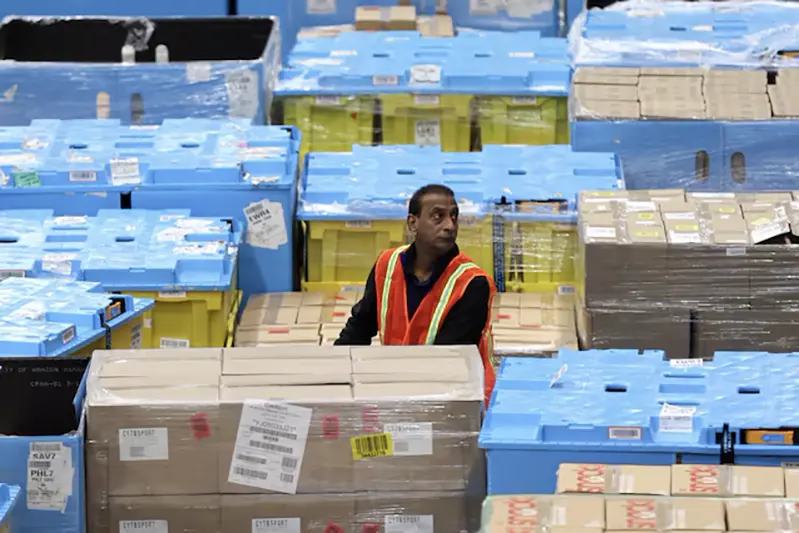 A worker moves products during Cyber Monday at the Amazon's fulfillment center in Robbinsville, New Jersey, U.S., November 27, 2023. REUTERS/Mike Segar/File Photo