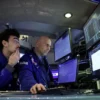 Specialist traders work inside a post on the floor at the New York Stock Exchange (NYSE) in New York City, U.S., December 2, 2024. REUTERS/Brendan McDermid/File Photo