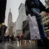 People carry shopping bags during the holiday season in New York City, U.S., December 15, 2022. REUTERS/Eduardo Munoz/File Photo