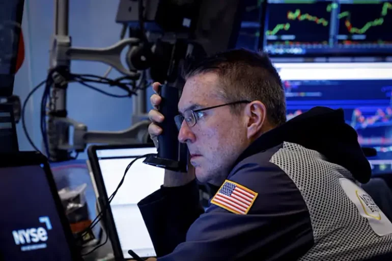 A trader works on the floor at the New York Stock Exchange (NYSE) in New York City, U.S., December 2, 2024. REUTERS/Brendan McDermid