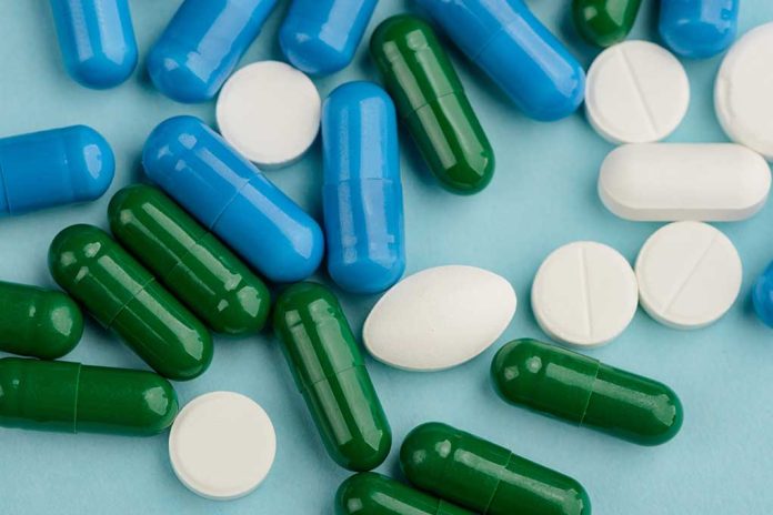 Blue, green, and white pills scattered on surface.