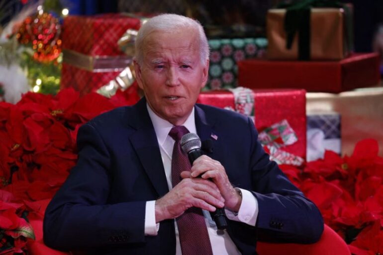 US President Joe Biden speaks during a holiday visit to patients and families at Children's National Hospital in Washington, DC, on December 20, 2024. (Photo by Ting Shen / AFP) (Photo by TING SHEN/AFP via Getty Images)