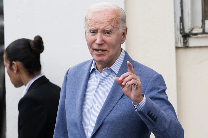 US President Joe Biden answers a question from the press as he exits Holy Cross Catholic Church after attending mass in Christiansted, St. Croix, on the US Virgin Islands, on December 28, 2024, during a week-long vacation on the island. (Photo by SAUL LOEB / AFP) (Photo by SAUL LOEB/AFP via Getty Images)