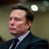 TOPSHOT - Elon Musk listens as US President-elect Donald Trump speaks during a meeting with House Republicans at the Hyatt Regency hotel in Washington, DC on November 13, 2024. (Photo by Allison ROBBERT / POOL / AFP) (Photo by ALLISON ROBBERT/POOL/AFP via Getty Images)