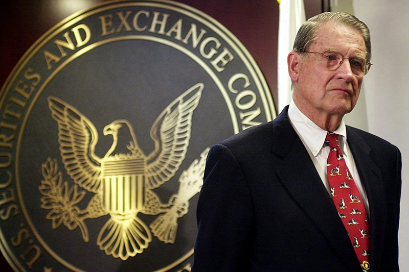 WASHINGTON, : William Webster listens to a question from the news media 25 October 2002 during a press conference after being voted chairman of a new Federal Securities and Exchange Commission Public Company Accounting Oversight Board at the SEC in Washington, DC. The SEC, in a divided vote, named Webster, former director of both the FBI and the Central Intelligence Agency, as chairman of a new Public Company Accounting Oversight Board. AFP PHOTO/Shawn THEW (Photo credit should read SHAWN THEW/AFP via Getty Images)