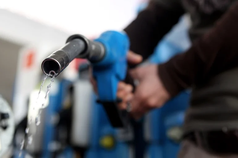 In this photo illustration a man refuels his car on March 23, 2010 in Munich, Germany. German President Horst Koehler said higher petrol prices could help make Germans become more environmentally conscious. (Photo Illustration by Miguel Villagran/Getty Images)