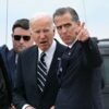 TOPSHOT - US President Joe Biden talks with his son Hunter Biden upon arrival at Delaware Air National Guard Base in New Castle, Delaware, on June 11, 2024, as he travels to Wilmington, Delaware. A jury found Hunter Biden guilty on June 11 on federal gun charges in a historic first criminal prosecution of the child of a sitting US president. The 54-year-old son of President Joe Biden was convicted on all three of the federal charges facing him, CNN and other US media reported. (Photo by ANDREW CABALLERO-REYNOLDS / AFP) (Photo by ANDREW CABALLERO-REYNOLDS/AFP via Getty Images)