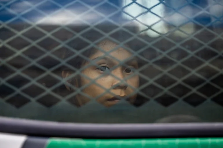 RUBY, ARIZONA - JUNE 24: A migrant child sits in the back of a border patrol vehicle after being apprehended by U.S. Customs and Border protection officers on June 24, 2024 in Ruby, Arizona. President Joe Biden has announced an immigration relief plan, which promises a path to citizenship for approximately 500,000 undocumented immigrants married to or adopted by U.S. citizens. Day's after Biden's announcement, Republican presidential candidate, former U.S. President Donald Trump announced to a podcast host that he would solidify green cards for foreign nationals who've received a U.S. college diploma. (Photo by Brandon Bell/Getty Images)