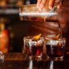 Bartender pouring cocktails