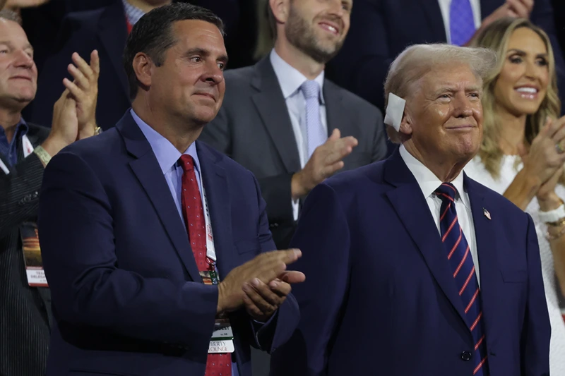 U.S. Rep. Devin Nunes (R-CA) and Republican presidential candidate, former U.S. President Donald Trump stand on the third day of the Republican National Convention at the Fiserv Forum on July 17, 2024 in Milwaukee, Wisconsin. Delegates, politicians, and the Republican faithful are in Milwaukee for the annual convention, concluding with former President Donald Trump accepting his party's presidential nomination. The RNC takes place from July 15-18. (Photo by Alex Wong/Getty Images)