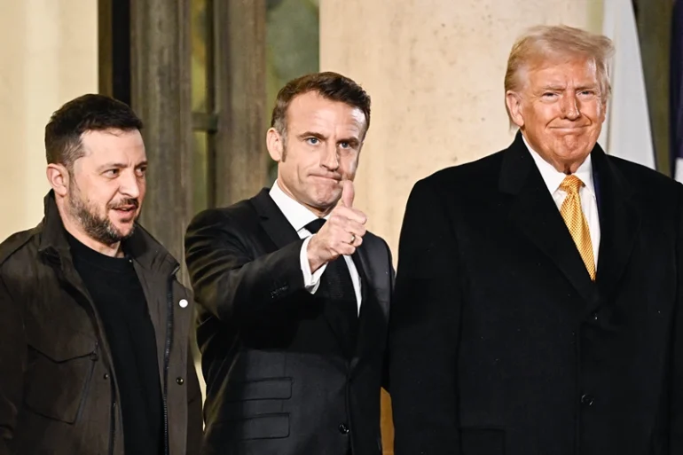 France's President Emmanuel Macron (C) thumbs up flanked by US president-elect Donald Trump (RO and Ukraine's President Volodymyr Zelensky (2nd L) after a meeting at The Elysee Presidential Palace in Paris on December 7, 2024. Trump makes his first international trip since his election win, preparing for a day of intense diplomacy before attending the reopening ceremony for the Notre Dame cathedral restored after the 2019 fire. (Photo by JULIEN DE ROSA / AFP) (Photo by JULIEN DE ROSA/AFP via Getty Images)