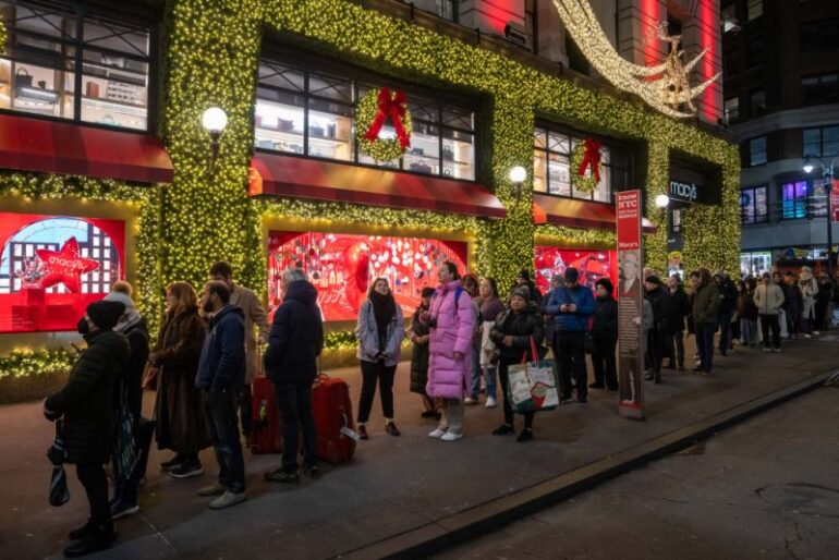 People line up outside of Macy's flagship store before opening on Black Friday, in New York City on November 29, 2024. The annual Black Friday shopping day has always been about finding the best deals, but this year retailers are preparing for a US consumer more zealously fixated than ever on getting value for their money. (Photo by Adam GRAY / AFP) (Photo by ADAM GRAY/AFP via Getty Images)