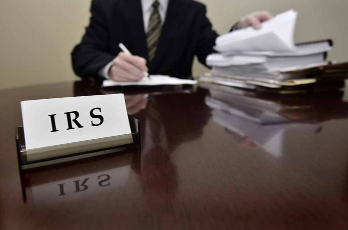 IRS sign on desk with person working