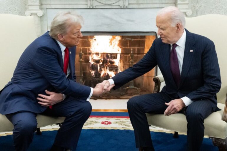 TOPSHOT - US President Joe Biden shakes hands with US President-elect Donald Trump during a meeting in the Oval Office of the White House in Washington, DC, on November 13, 2024. Trump thanked Biden for pledging a smooth transfer of power as the victorious Republican made a historic return visit to the White House on Wednesday. (Photo by SAUL LOEB / AFP) (Photo by SAUL LOEB/AFP via Getty Images)