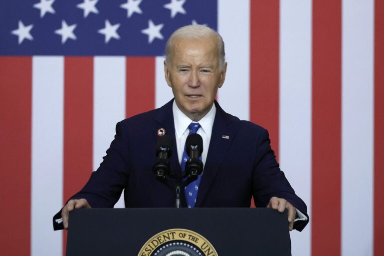 President Joe Biden speaking at the Department of Labor podium on December 16, 2024, after signing a proclamation to establish the Frances Perkins National Monument.