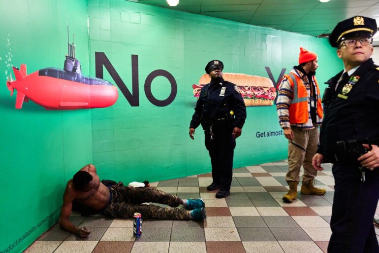 Police and city outreach workers from a PATH team roam Herald Square Station to offer the homeless shelter and city services.