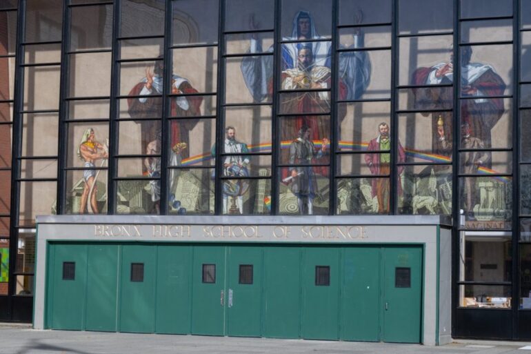 Bronx High School of Science building with a mural on the side, known for producing more Nobel laureates than any other secondary school.