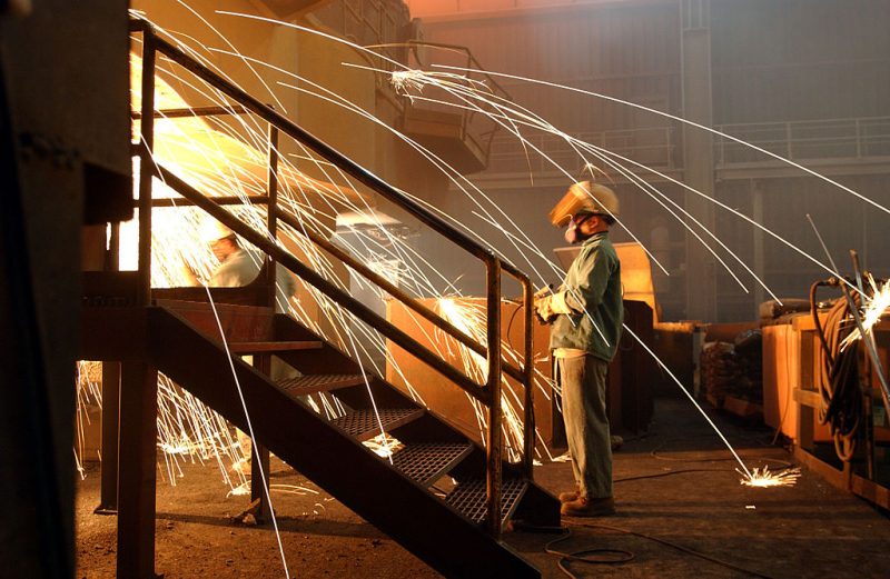 RANCHO CUCAMONGA, CA - OCTOBER 4: A worker is surrounded by sparks from molten steel flowing into casts at the TAMCO steel mini mill on October 4, 2002 in Rancho Cucamonga, California. TAMCO, California's only steel mill, has managed to persevere through skyrocketed electrical rates as it uses electric arc furnace technology to turn scrap steel into concrete reinforcing bars (rebar). Last March, the Bush administration imposed tariffs of 8 percent to 30 percent on certain kinds of steel imports, a move that now has the European Union threatening to retaliate by seeking $350 million in steel trade sanctions against the United States. Nationally, 34 steel companies have gone bankrupt and 17 have shut down since the 1997 Asian financial crisis, putting 52,000 steelworkers out of work. (Photo by David McNew/Getty Images)