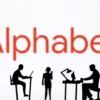 Figurines with computers and smartphones are seen in front of Alphabet logo in this illustration taken, February 19, 2024. REUTERS/Dado Ruvic/Illustration