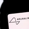 Neuralink logo and Elon Musk silhouette are seen in this illustration taken, December 19, 2022. REUTERS/Dado Ruvic/Illustration/File Photo