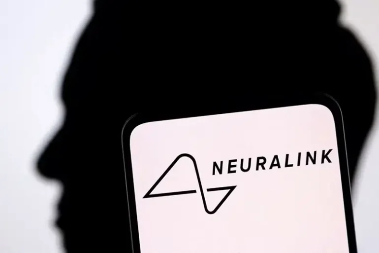 Neuralink logo and Elon Musk silhouette are seen in this illustration taken, December 19, 2022. REUTERS/Dado Ruvic/Illustration/File Photo