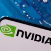 A smartphone with a displayed NVIDIA logo is placed on a computer motherboard in this illustration taken March 6, 2023. REUTERS/Dado Ruvic/Illustration/File Photo