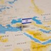 Israeli flag marking Israel on a world map.