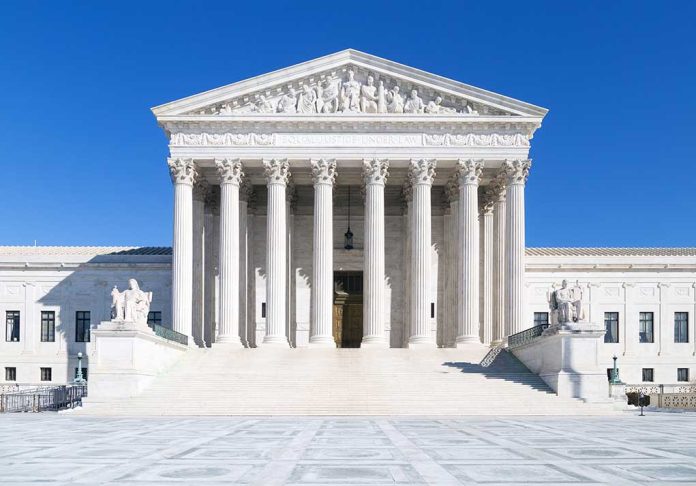 United States Supreme Court building under clear blue sky