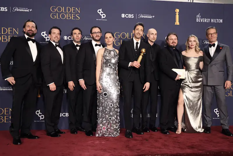 Trevor Matthews, Brian Young, Felicity Jones, Adrien Brody, winner of the Best Performance by a Male Actor in a Motion Picture - Drama award for "The Brutalist," Daniel Blumberg, Brady Corbet, Mona Fastvold, and Guy Pearce, winners of the Best Motion Picture - Drama award for "The Brutalist", pose at the 82nd Golden Globe Awards in Beverly Hills, California, U.S., January 5, 2025. REUTERS/Mario Anzuoni