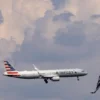 An American Airlines commercial aircraft flies over Washington as it approaches to land at Dulles International Airport, as seen from Washington, U.S., August 5, 2024. REUTERS/ Umit Bektas/File Photo