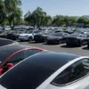 Tesla electric vehicles are parked in a storage lot outside a disused movie theatre in Scottsdale, Arizona, U.S., June 11, 2024. REUTERS/Go Nakamura/File Photo