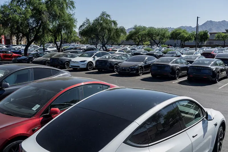 Tesla electric vehicles are parked in a storage lot outside a disused movie theatre in Scottsdale, Arizona, U.S., June 11, 2024. REUTERS/Go Nakamura/File Photo