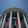 TOPSHOT - A Pride flag is displayed during a Pride celebration on the South Lawn of the White House in Washington, DC, on June 10, 2023. (Photo by Brendan Smialowski / AFP) (Photo by BRENDAN SMIALOWSKI/AFP via Getty Images)