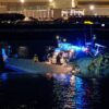 ARLINGTON, VIRGINIA - JANUARY 30: (EDITORS NOTE: Image contains graphic content) Emergency response units assess airplane wreckage in the Potomac River near Ronald Reagan Washington Airport on January 30, 2025 in Arlington, Virginia. An American Airlines flight from Wichita, Kansas collided with a helicopter while approaching Ronald Reagan National Airport. (Photo by Andrew Harnik/Getty Images)