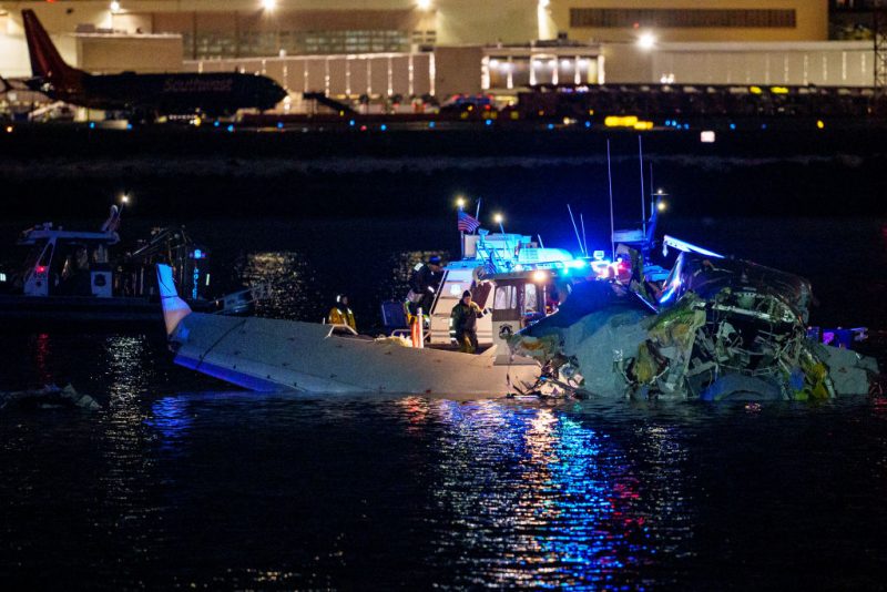 ARLINGTON, VIRGINIA - JANUARY 30: (EDITORS NOTE: Image contains graphic content) Emergency response units assess airplane wreckage in the Potomac River near Ronald Reagan Washington Airport on January 30, 2025 in Arlington, Virginia. An American Airlines flight from Wichita, Kansas collided with a helicopter while approaching Ronald Reagan National Airport. (Photo by Andrew Harnik/Getty Images)