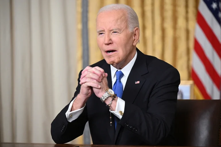 US President Joe Biden clasps his hands as he delivers his farewell address to the nation from the Oval Office of the White House in Washington, DC, on January 15, 2025. (Photo by Mandel NGAN / POOL / AFP) (Photo by MANDEL NGAN/POOL/AFP via Getty Images)