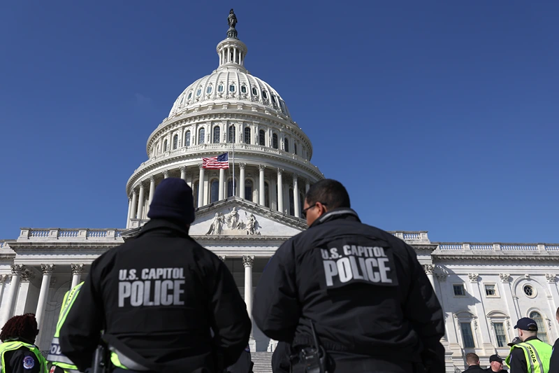 F U.S. Capitol police officers gather on the east front plaza of the Capitol on February 28, 2022 in Washington, DC. Security has been heightened and fencing was erected around the U.S. Capitol ahead of U.S. President Joe Biden's State of the Union address on Tuesday evening. (Photo by Justin Sullivan/Getty Images)