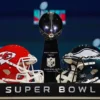 PHOENIX, ARIZONA - FEBRUARY 08: A view of the Vince Lombardi Trophy and the helmets of the Kansas City Chiefs and the Philadelphia Eagles before a press conference for NFL Commissioner Roger Goodell at Phoenix Convention Center on February 08, 2023 in Phoenix, Arizona. (Photo by Peter Casey/Getty Images)