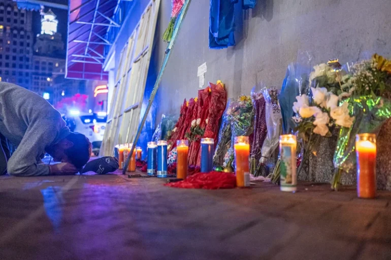 TOPSHOT - A man reacts as he prays at a memorial on Bourbon Street after it reopened to the public on January 2, 2025, in New Orleans, Louisiana, following an attack on January 1 which left 14 dead. A US army veteran loyal to the Islamic State jihadist group likely acted alone when he killed 14 and injured dozens in a truck attack on a crowd of New Year revelers in New Orleans, the FBI said on January 2. (Photo by ANDREW CABALLERO-REYNOLDS / AFP) (Photo by ANDREW CABALLERO-REYNOLDS/AFP via Getty Images)