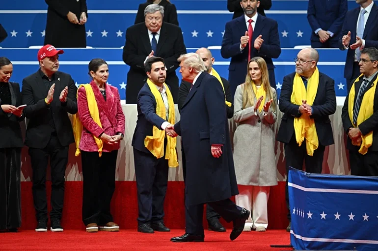 US President Donald Trump greets relatives of Israeli hostages taken by Hamas during the inaugural parade inside Capital One Arena, in Washington, DC, on January 20, 2025. (Photo by ANGELA WEISS / AFP) (Photo by ANGELA WEISS/AFP via Getty Images)