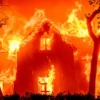 TOPSHOT - A home is engulfed in flames during the Eaton fire in the Altadena area of Los Angeles County, California on January 8, 2025. (Photo by JOSH EDELSON / AFP) (Photo by JOSH EDELSON/AFP via Getty Images)