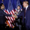 NASHUA, NEW HAMPSHIRE - JANUARY 23: Republican presidential candidate and former U.S. President Donald Trump (R) shakes hands with former candidate Vivek Ramaswamy during a primary night party at the Sheraton on January 23, 2024 in Nashua, New Hampshire. New Hampshire voters cast their ballots in their state’s primary election today, with former President Donald Trump winning the primary, finishing ahead of former UN Ambassador Nikki Haley. (Photo by Chip Somodevilla/Getty Images)