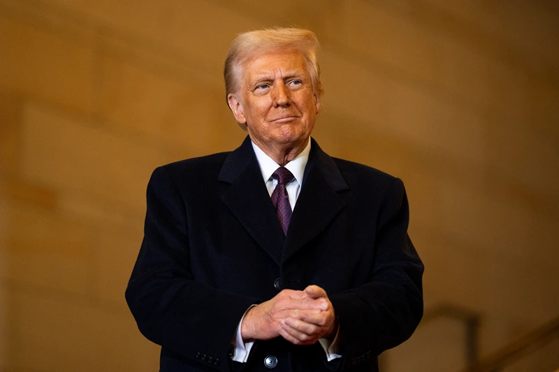 US President Donald Trump waits to speak in Emancipation Hall during inauguration ceremonies at the US Capitol in Washington, DC, on January 20, 2025. (Photo by Greg Nash / POOL / AFP) (Photo by GREG NASH/POOL/AFP via Getty Images)