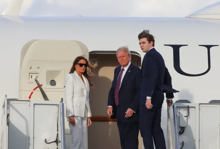 US President-elect Donald Trump, his wife Melania Trump and their son Barron board a US government aircraft at Palm Beach International Airport in West Palm Beach, Florida, on January 18, 2025. Trump is headed to Washington, DC, for his inauguration on January 20. (Photo by Eva Marie UZCATEGUI / AFP) (Photo by EVA MARIE UZCATEGUI/AFP via Getty Images)